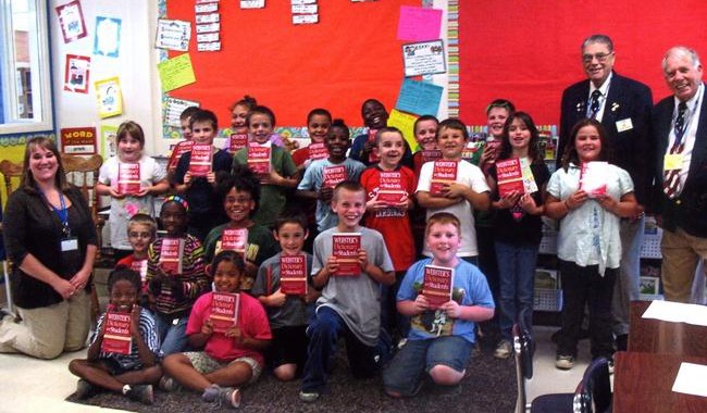 Students in Leeanne Sckerpe’s third-class at Gale Elementary show off the dictionaries provided by Elk’s Lodge #894 with their teacher and Elks’ member Al Urena.