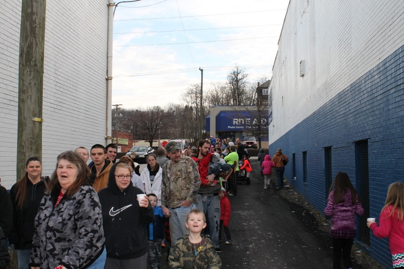 The line-up of children (and their parents) prior to opening the doors at 9:00 am Christmas morning