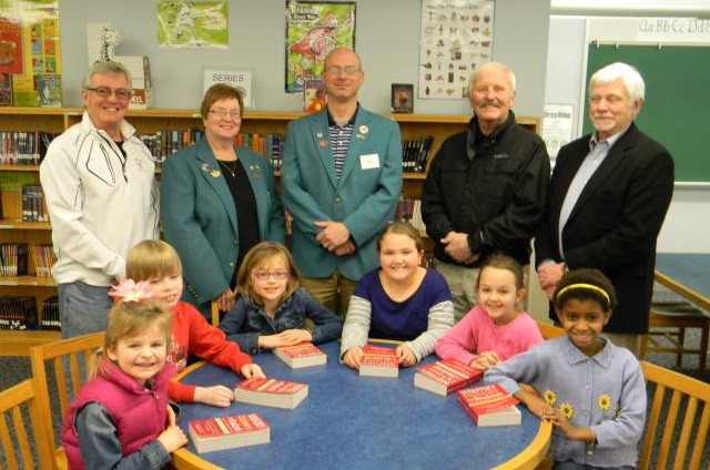 Students pose with members from the Jamestown Elks Lodge # 263. The Club has distributed over 9,800 books to the Chautauqua County Public School District since beginning the Dictionary Project in 2004.