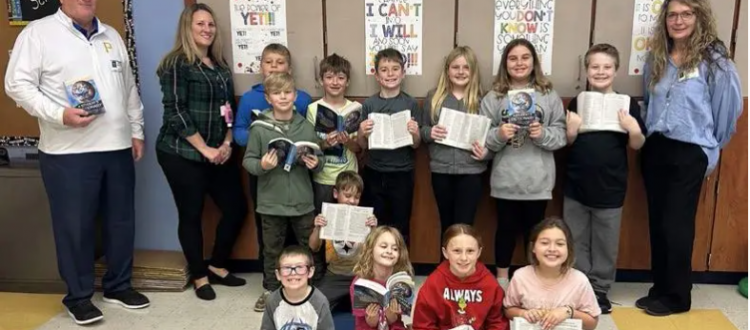 Pictured are Monongahela Rotarians Tom Graney, far left, and Deb Mangino, far right, and Kelli Schmeltz with her third-grade class at Ringgold Elementary North (Photo courtesy of the Rotary Club of Monongahela)