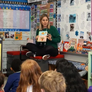 Teacher Jill Anderson reads to her class. Concerned about effects on students, Anderson has removed most screen time from her classroom. Photo Credit: Jackie Mader/The Hechinger Report